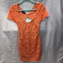 BEBE orange lace dress with nude underline- size small. Excellent condition!