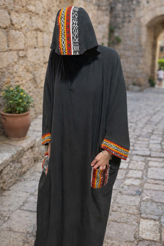 A unique traditional embroidered cloak with a head covering