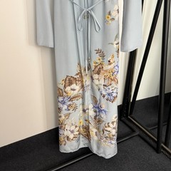 Zimmermann floral and bird print long-sleeved dress with a belted waist.