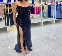 Black dress adorned with rhinestones,High thigh-slit and open back piece