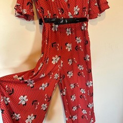 True Destiny red floral maxi jumper pant with black belt. Size L fits M. Capri