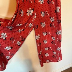 True Destiny red floral maxi jumper pant with black belt. Size L fits M. Capri