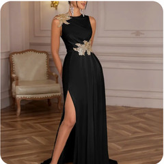 New floor-length formal gown size women&rsquo;s large in black with gold leaf appliqué