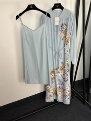 Zimmermann floral and bird print long-sleeved dress with a belted waist.