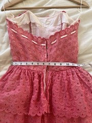 1950s pink strapless ruffle eyelet dress with white bow detail