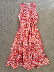Entro boutique dress features a flowy, sleeveless high-neck ruffle detail.