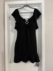 Derek Heart Women&rsquo;s Black Ruffle Sleeve Mini Dress with Rhinestone Brooch Detail