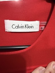Calvin Klein Red Solid Pleated Sheath Dress 6 Round Neck Sleeveless Knee