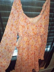 Jessica Simpson floral boho dress features long sleeves and side cutouts. LG